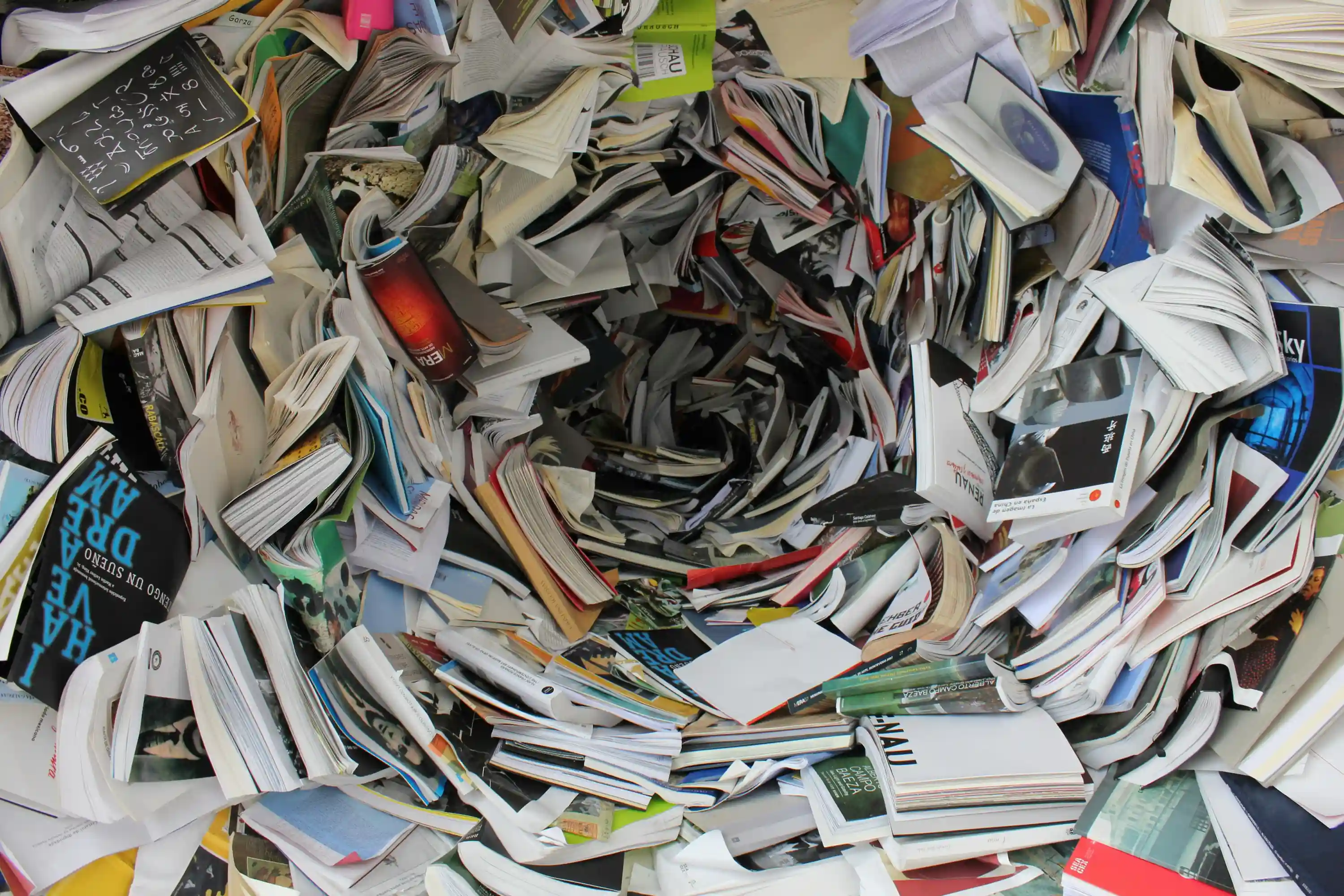 Assessor dealing with messy photo evidence and paperwork